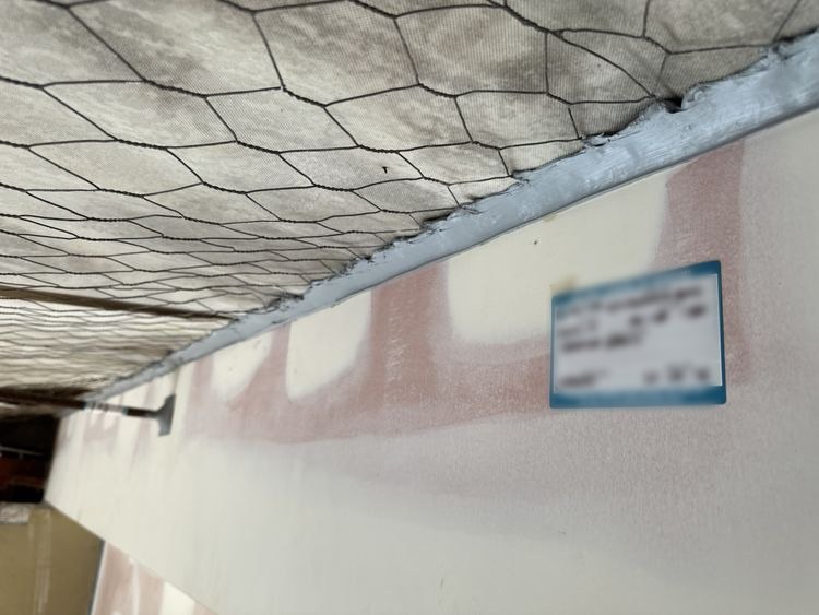 Long head-of-wall linear gap seal to the roof with compliance tag